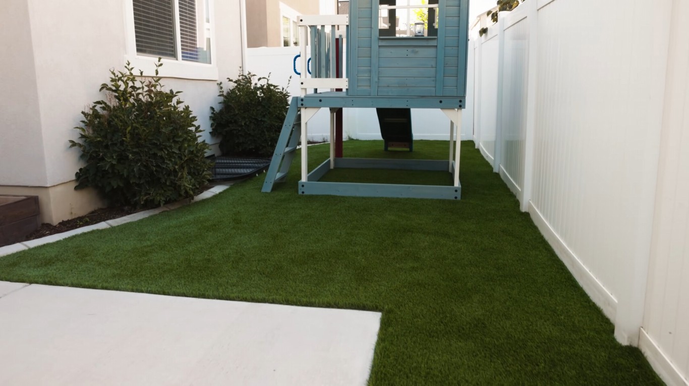 Safe playground area with artificial grass installation under playhouse in Moreno Valley, CA
